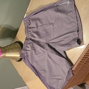 Nike dry fit men's running shorts size small with pockets.